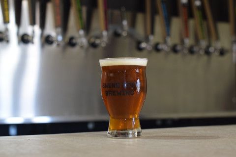 A glass of beer on the bar at Swine City Brewing in Fairfield, OH