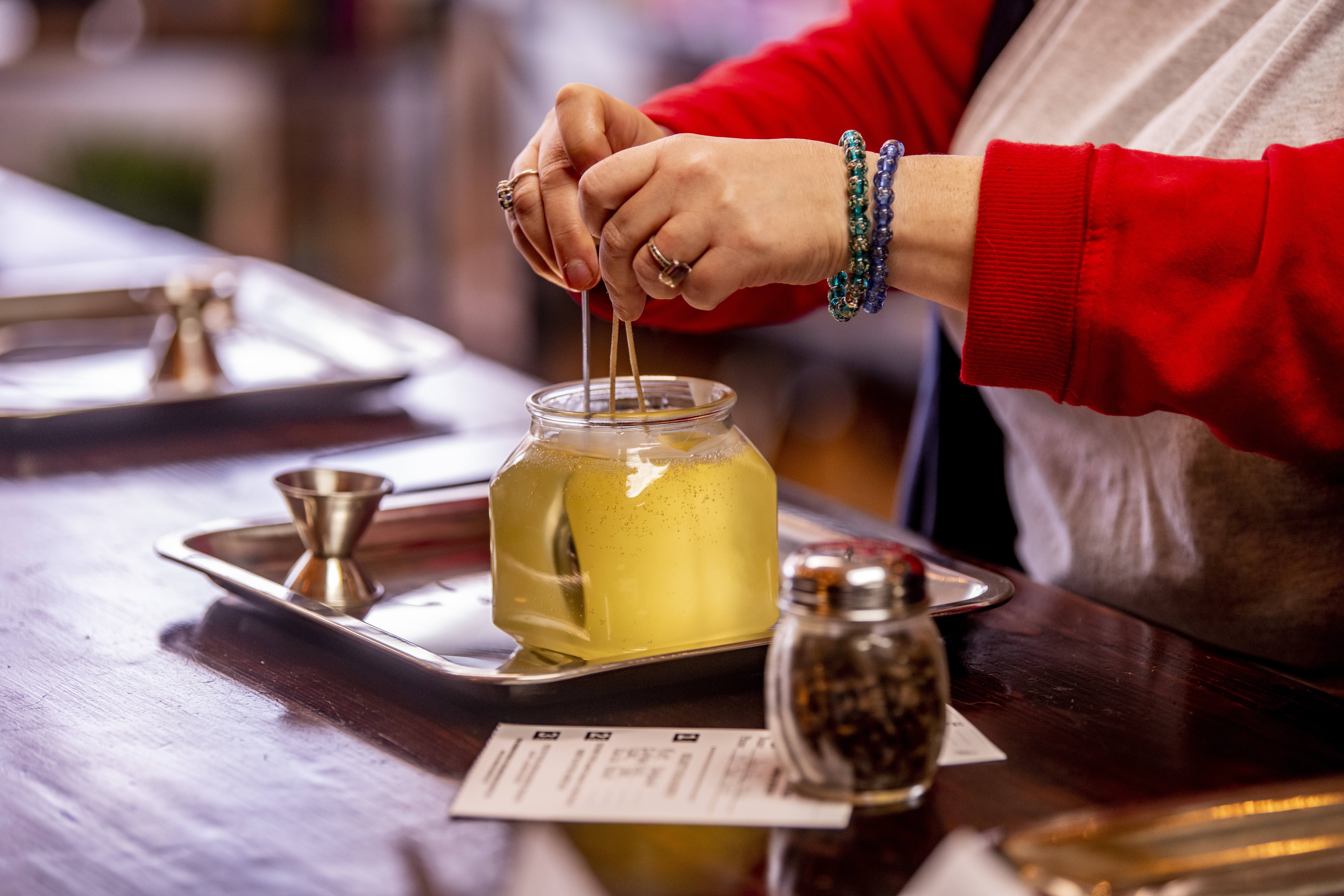 Candle wax being poured and set by a customer at Petals and Wicks